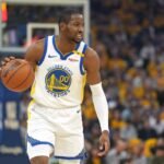 jonathan-kuminga-looks-to-make-a-play-during-a-playoff-game-against-the-houston-rockets-in-2024